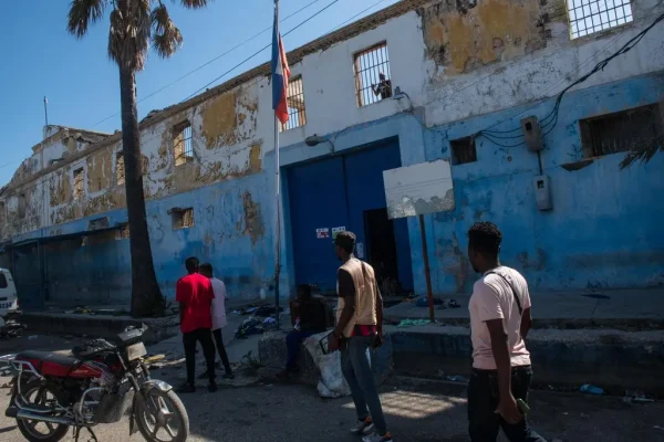 Haitians outside the national penitentiary in Port-au-Prince on Sunday, after an attack by armed gangs.Credit...Johnson Sabin/EPA, via Shutterstock