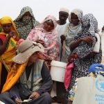 Food is distributed to Sudanese refugees in Koufron, Chad.