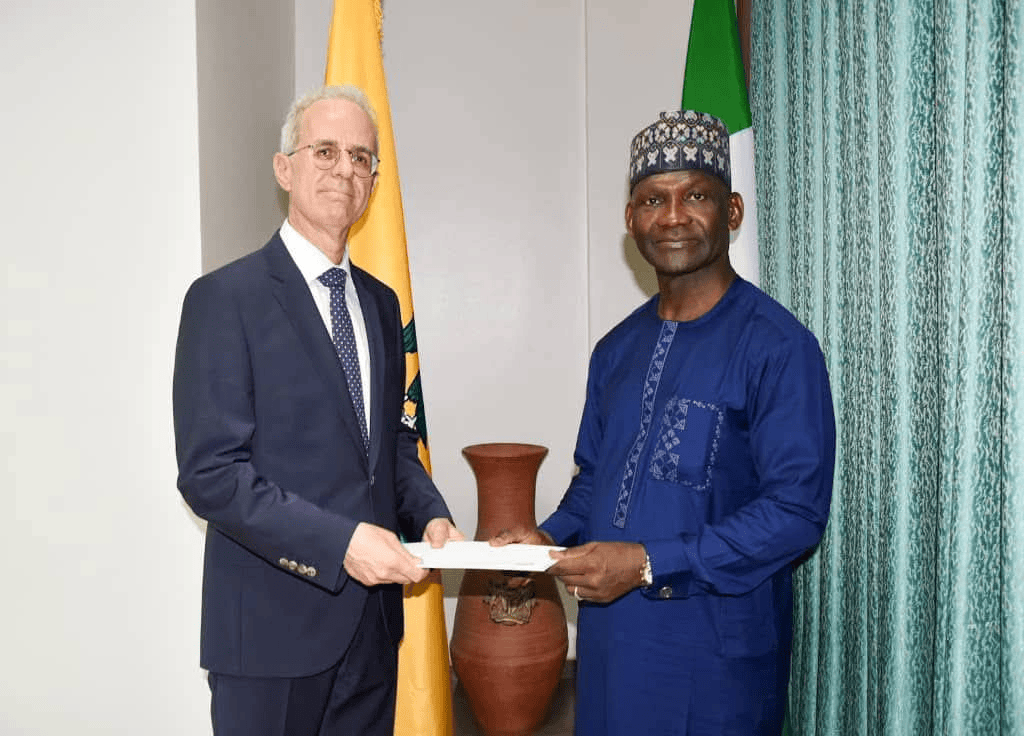 Left - right: Turkey's Ambassador to Nigeria, Mehmet Poroy, presenting a copy of his letter of credence to Ambassador Wahab A. Akande, Chief of Protocol at Nigeria's Ministry of Foreign Affairs on May 2, 2025. Photo: Abdullahi Yusuf/Peacemagazine.com.ng